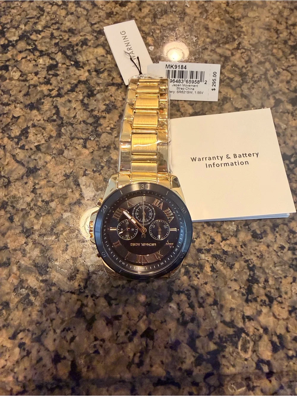 Michael Kors gold tone